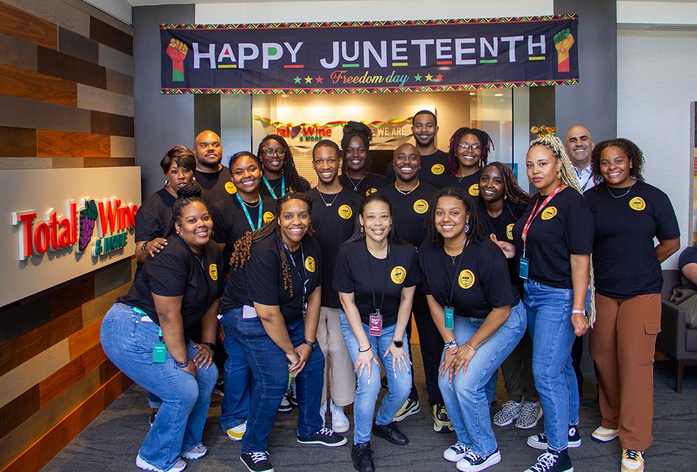 Group of Total Wine employees posing in the office for Juneteenth